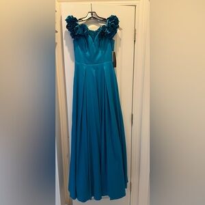 A formal evening dress never worn with a tag on. Dress runs big.